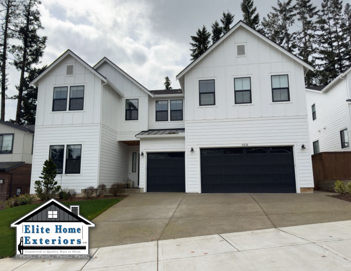 White lap siding and board and batten siding exterior home remodel with Hardy siding
